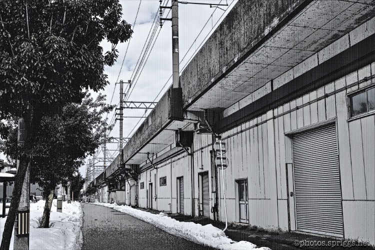 ishikawa-tetsedo line from the south heading into kanazawa station railway viaduct